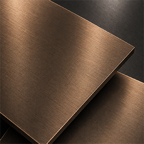 Close-up of a brushed bronze effect finish sample with warm copper-brown tone for sculpture