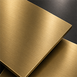 Close-up of a warm brushed brass finish sample with soft golden sheen for luxury sculpture