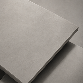 Close-up of a matte grey concrete effect finish sample with fine mineral texture for sculpture